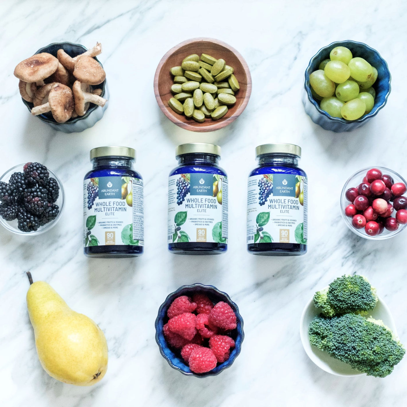Abundant-earth-whole-food-multivitamin-with-organic-fruits-and-vegeatbles-on-countertop